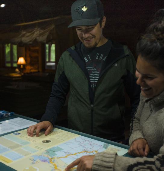 Visitors looking at a map in Blackstone Visitor Center