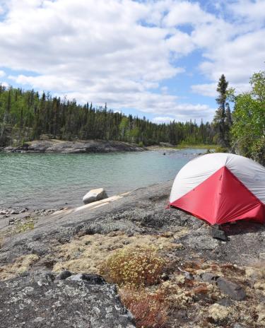 Tent on an island at Hidden Lake Territorial Park