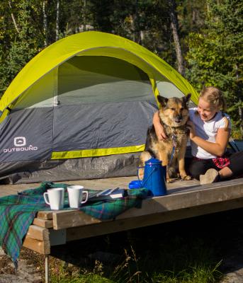 Dog with child and tent on platform