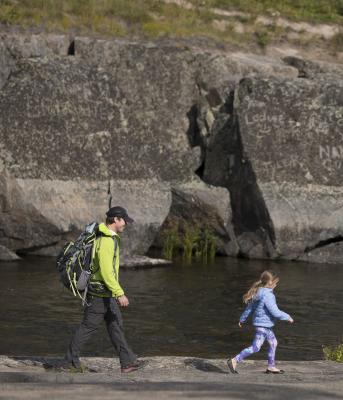 family walking riverside