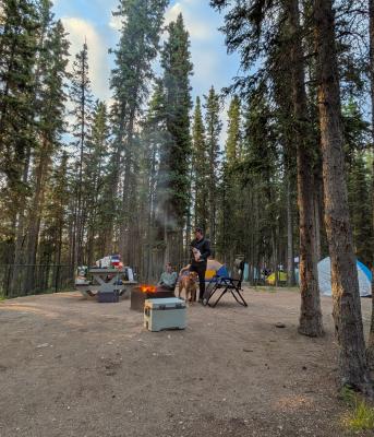 Campers at Lady Evelyn Falls with a dog and campfire